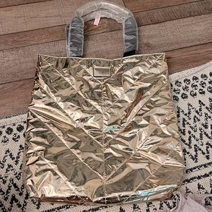 Victoria Secrets Rose Gold bag still has strap protectors and tag